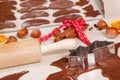 Cookie cutters, rolling pin and dough for Christmas cookies or gingerbread Royalty Free Stock Photo