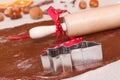 Cookie cutters, rolling pin and dough for baking festive cookies or gingerbread, Christmas time concept Royalty Free Stock Photo