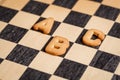 Cookie letters on black checkboard squares