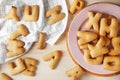 Cookie letters on wooden table Royalty Free Stock Photo