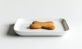A cookie is sitting on a white plate Royalty Free Stock Photo