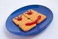 Cookie smile on blue plate Royalty Free Stock Photo