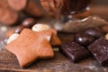 Cookie star with chocolate on wood closeup