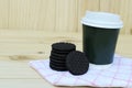 Cookie and take away coffee cup on wooden backgrounds Royalty Free Stock Photo