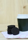 Cookie and take away coffee cup on wooden bacgrounds Royalty Free Stock Photo