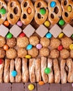 Cookie and waffle assortment in rows and multicolored candy dragees