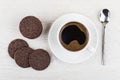 Cookies with airy rice, chocolate, coffee, spoon on light table