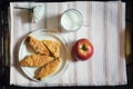 Cookies, apple and milk on a tray, healthy breakfast