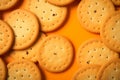 Cookies arranged on an orange surface, a tasteful and inviting presentation