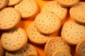 Cookies arranged on an orange surface, a tasteful and inviting presentation