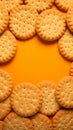 Cookies arranged on an orange surface, a tasteful and inviting presentation