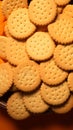 Cookies arranged on an orange surface, a tasteful and inviting presentation