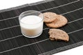 Cookies on a black backhander with a glass of milk Royalty Free Stock Photo