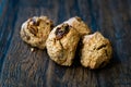 Cookies with Bran Flour and Raisin on Dark Wooden Surface