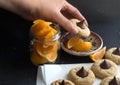 cookies with chocolate candy kiss, sliced orange pieces, hand taking cookie Royalty Free Stock Photo