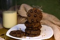 Cookies with chocolate granules served with a glass of milk are very appropriate served as morning snacks, have a lot of protein, Royalty Free Stock Photo