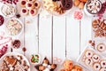 Christmas cookies and baking frame, top view table scene over a white wood background Royalty Free Stock Photo