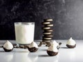 Cookies & Cream Cake Balls, truffle like dessert with a fresh glass of cold milk, a silver spoon, chocolate sandwich cookies and c Royalty Free Stock Photo