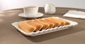 cookies with a cup of coffee on the table. strudel with fruit filling on a white plate. pastries on a brown background.