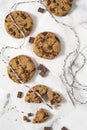 Cookies with dark chocolate chips and string on white plate. Royalty Free Stock Photo