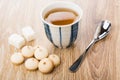 Cookies with egg glaze, sugar, spoon, cup of tea Royalty Free Stock Photo