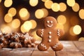 Cookies in the form of gingerbread men on the background of Christmas lights bokeh Royalty Free Stock Photo