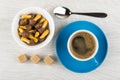 Cookies in form mushroom in bowl, coffee, sugar cubes, spoon