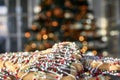 Cookies in front oaf a blurred Christmas tree