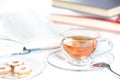 Cookies, glass of tea and books Royalty Free Stock Photo