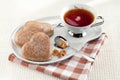 Cookies heart, sugar, spoon, black tea, saucer Royalty Free Stock Photo