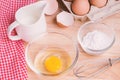 Cookies ingredients.Bowl, flour, eggs, jar of milk, eggbeater