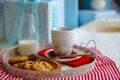 Cookies, milk, gift box on white tray Royalty Free Stock Photo