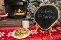 Cookies and milk for Santa by the Christmas tree.