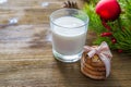 Cookies and milk for Santa Clause on wood background Royalty Free Stock Photo