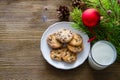 Cookies and milk for Santa Clause on wood background