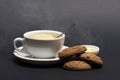 Cookies near tea on dark grey background. Sweet bakery Royalty Free Stock Photo
