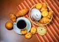 Cookies, pastries and coffee cup on wooden background