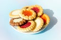 cookies on plate against blue background. round cookies laid out on saucer. copy space, top view Royalty Free Stock Photo