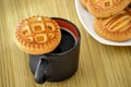 Cookies on a plate and a cup of black coffee. Royalty Free Stock Photo