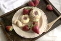 cookies on plate with strawberries. Homemade cookies filled with strawberry jam