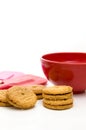 Cookies with Red Bowl and Red and Pink Spatula Isolated on White