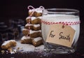 Cookies for Santa with glass of milk with tag for Santa and christmas tree Royalty Free Stock Photo