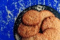 Cookies with sesame seeds on a blue background