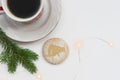 Cookies with a silhouette of a bull, a symbol of the eastern horoscope and a mug with coffee on a light table. The concept of a fe