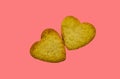 Cookies two hearts on a pink red background close-up Royalty Free Stock Photo