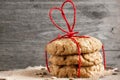 Cookies for Valentine`s Day with red heart shaped ribbon on wood Royalty Free Stock Photo