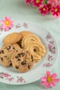 Cookies variety on plate with flowers