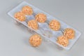 Cookies wafer balls with peanut cream filling in plastic packaging Royalty Free Stock Photo