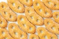 Cookies of yellow color, sweet pretzels in sugar, large crystals of sugar, on a white background, isolated