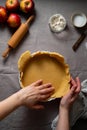 Cooking apple pie pastry. Raw dough in pie tin. Royalty Free Stock Photo